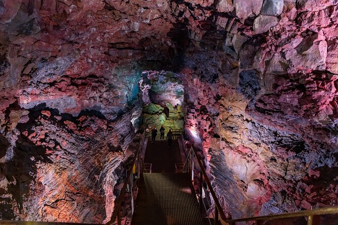 From Reykjavík: Evening Lava Tunnel Tour and Northern Lights Tour - Entering Raufarhólshellir with a helmet and torch
