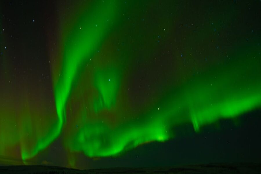From Reykjavik: Northern Lights Guided Tour with Photos - Hot chocolate, blankets, and cold-weather reality