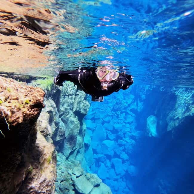 From Reykjavik: Silfra Snorkeling with Free Photos - Getting fitted for a drysuit or wetsuit