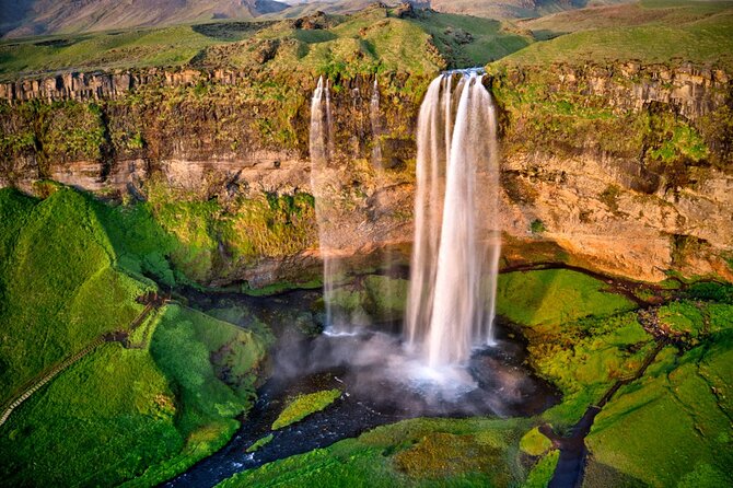 Full Day Private Bespoke South Coast Tour - Skógafoss brings scale and a climb