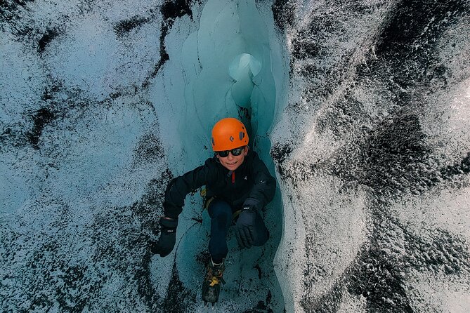Glacier Hike at Sólheimajökull Shared Experience - Getting fitted with crampons and an ice ax