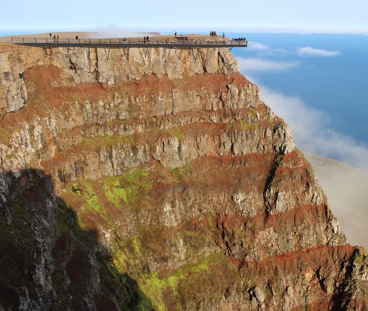 Isafjordur: Bolafjall View Platform Guided Trip by Bus - The steep gravel road and highlands bus
