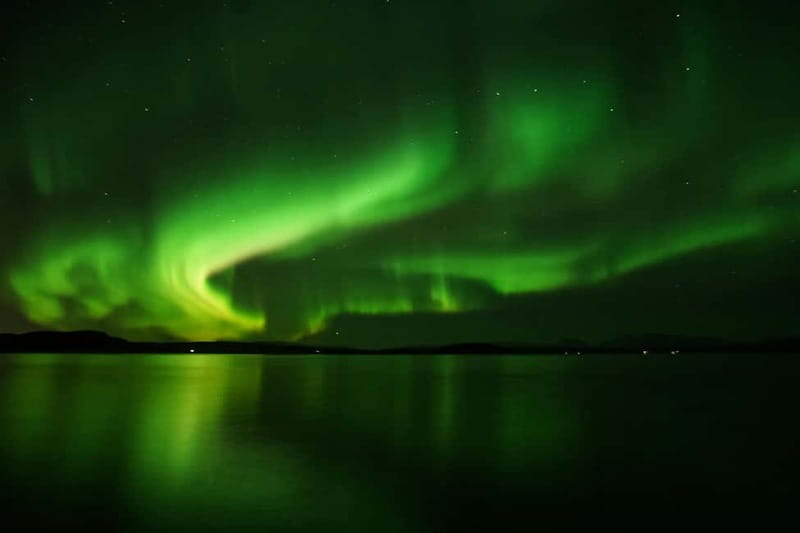Reykjavik: Northern Lights Adventure Tour with Hot Chocolate - A warm bus and a 30-minute ride