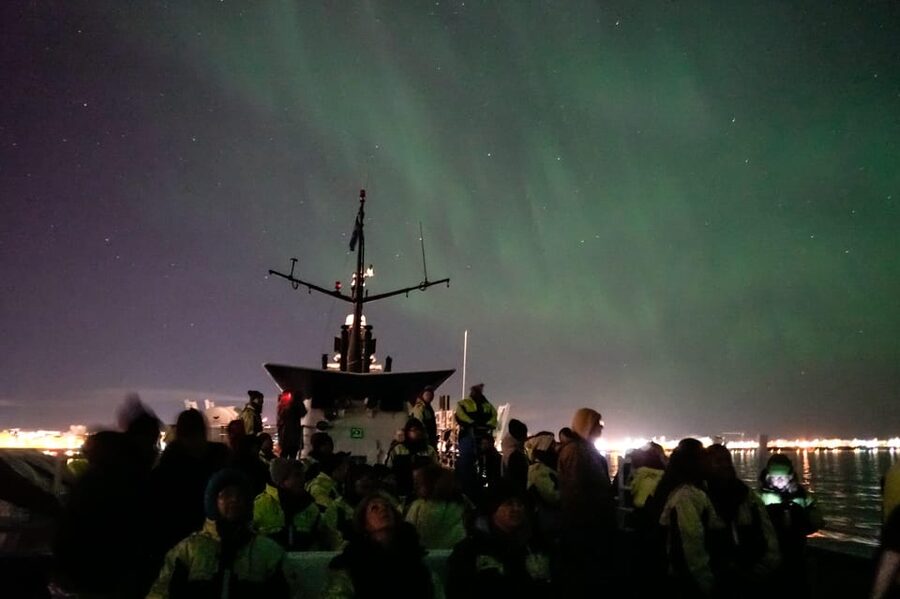 Reykjavik: Northern Lights Guided Boat Tour with Photos - Leaving Reykjavik Old Harbour after dark
