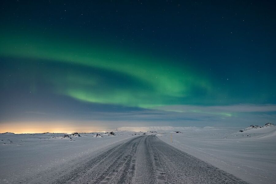 Reykjavík: Northern Lights Minibus Tour with Photos - Waiting in the cold, with hot chocolate in hand