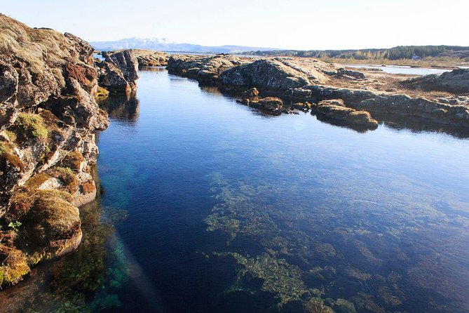 Silfra Drysuit Snorkeling with Free Photos - Meet on Location - The 40-minute swim through Silfra