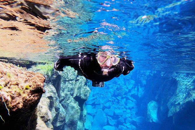 Silfra Drysuit Snorkeling with Free Photos - Meet on Location - The careful process of getting dressed