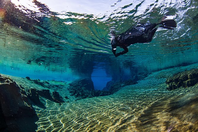 Silfra: Snorkeling Between Tectonic Plates Pick Up from Reykjavik - Entering the cold water at Silfra